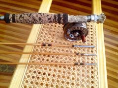 Bamboo fly rod with deer antler reel seat.