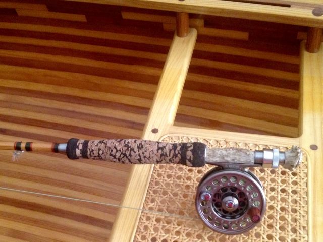 Bamboo fly rod with deer antler reel seat.