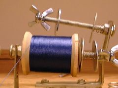 Thread tension device