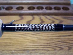 feather inlay on fly rod