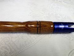 Dark brown wood like Marbleized Rod with roller guides